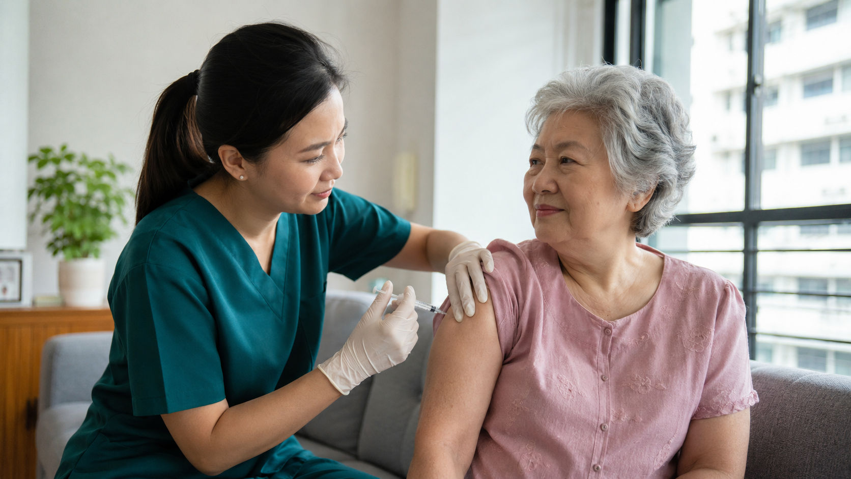 Nurse in green scrubs caring for a line and IV on a patient's arm at home